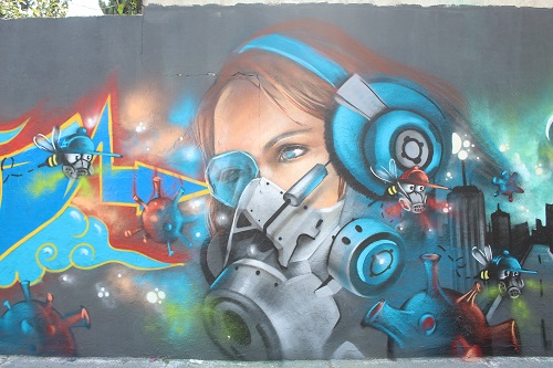Plasman mural del coronavirus en calles poblanas