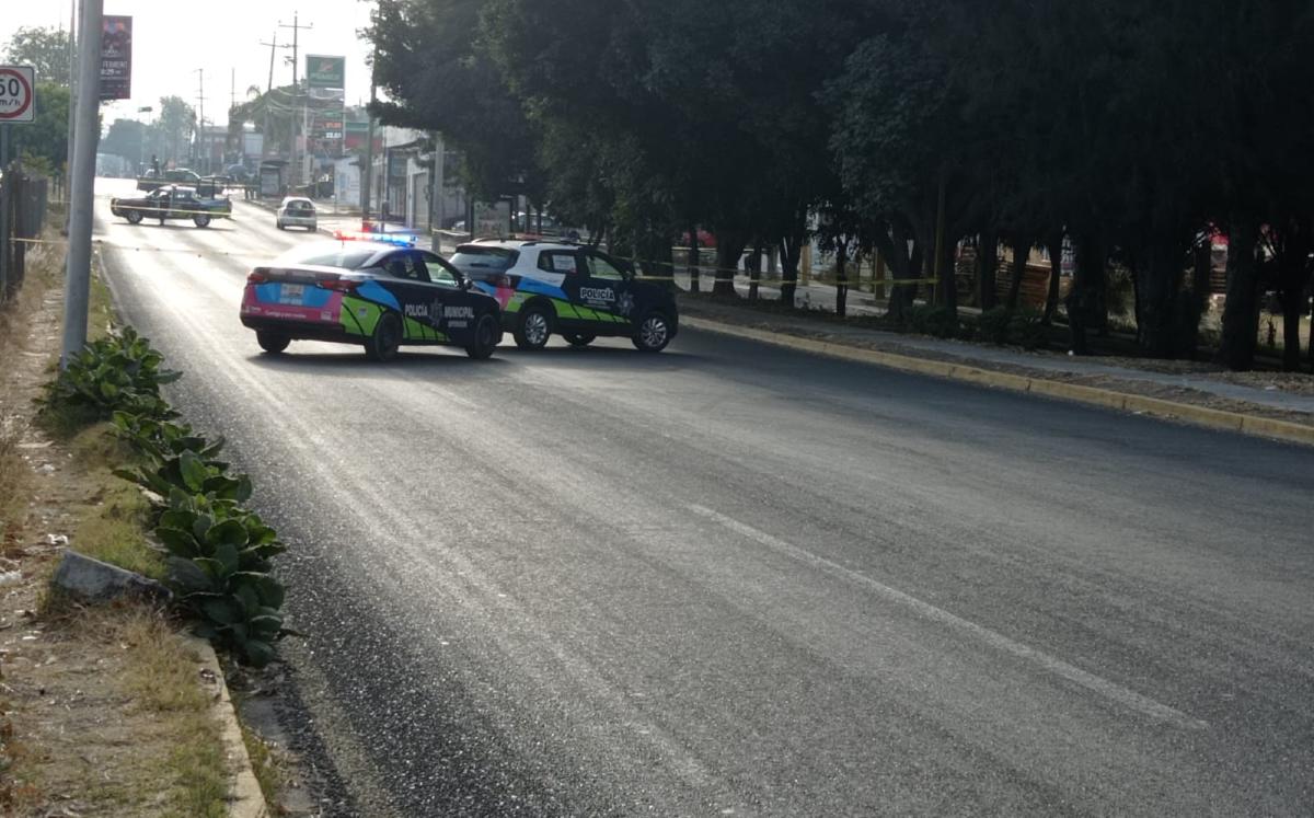 Patrullas de la SSC Puebla en la escena donde dos hermanos fueron asesinados / Miguel Ángel Miñón