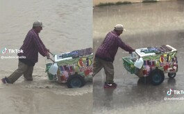 Abuelito conmueve en redes por llevar su carrito de helados en plena lluvia