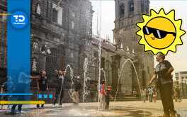 niños se mojan en fuentes por el calor