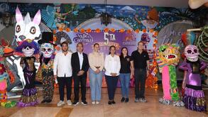 personas presentan un festival de día de muertos