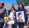 Personas caminan en un sepulcro con imágenes de Stephany Carmona, joven poblana asesinada en la Guardia Nacional. Personas caminan en un sepulcro con imágenes de Stephany Carmona, joven poblana asesinada en la Guardia Nacional.