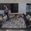 una mujer afuera de una casa inundada por las lluvias en la sierra norte de puebla una mujer afuera de una casa inundada por las lluvias en la sierra norte de puebla