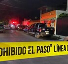 Área acordonada en escena del crimen.