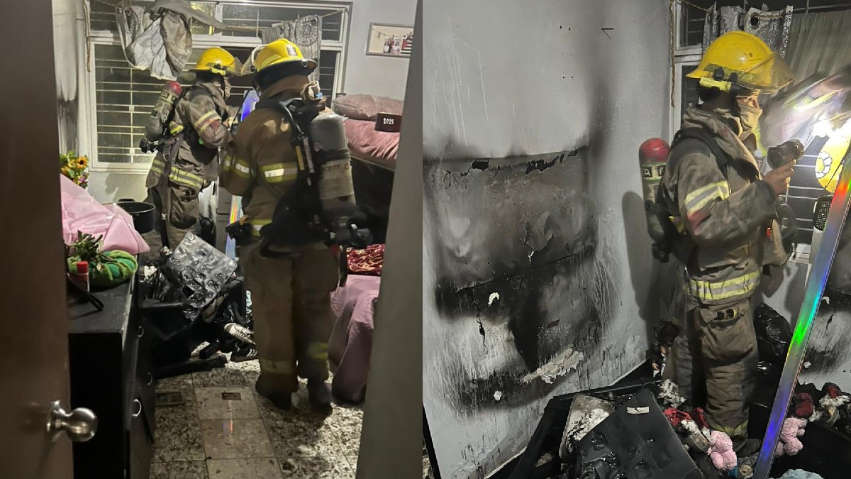 Bomberos extinguiendo el fuego al interior de un domicilio