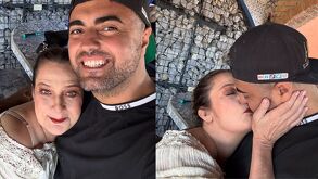 Diana Golden junto a su nueva pareja, abrazados y dandose un beso en la boca.