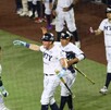 Jugadores de Sultanes de Monterrey en un partido de beisbol.