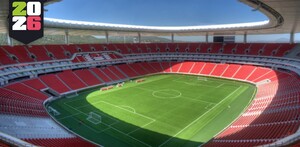 Vista panorámica y aérea del Estadio Akron (de Chivas) en Guadalajara. El campo de fútbol verde brillante está rodeado por miles de asientos de color rojo inten