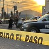 Cinta amarilla de prohibido el paso al lado de una patrulla de policía