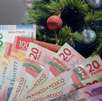 Billetes mexicanos y árbol de Navidad por aguinaldo 2025