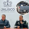 Autoridades en materia de seguridad de Jalisco sentados detrás de una mesa con micrófonos ante los medios de comunicación