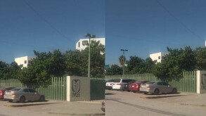 Clínica del IMSS en color verde y blanco y un automóvil blanco