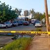 Momento en que autoridades acordonan el salón de eventos en Coatzacoalcos tras el asesinato.