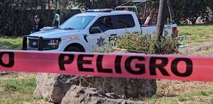 Patrulla de Tlajomulco y cintas de precaución