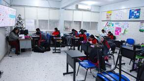 Niños en salón de clases.