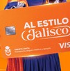 Tarjeta Única de Jalisco color naranja con el eslogan Al Estilo Jalisco siendo sostenida por una mujer con traje típico tapatío
