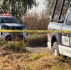 Policía resguarda con cinta amarilla una zona de crimen en Tlaxcala.