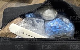 Metanfetaminas y armas en mochila