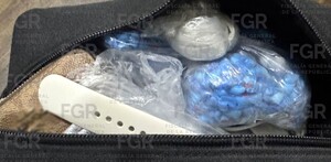 Metanfetaminas y armas en mochila