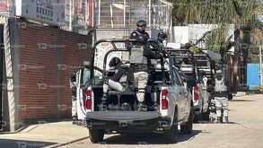 Elementos de la Guardia Nacional a bordo de una patrulla en el Barrio del Perdón de Cuautlancingo.