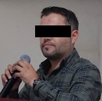 Diego Rivera Navarro, presidente municipal de Tequila, con los ojos censurados por un recuadro negro vistiendo un chaleco negro y con personas de fondo