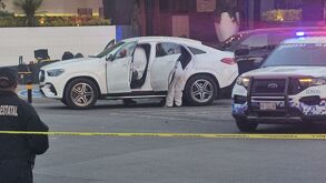 Fotografía del equipo forense trabajando luego del levantamiento de los cuerpos en Angelópolis.