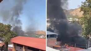 Imágenes de columnas de humo saliendo de los tejados de viviendas en Michoacán debido a quema de vehículos