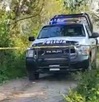 patrulla de policía en un lugar donde fue encontrado el cadáver de una mujer en papantla