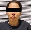 Mujer con cinta sobre los ojos detenida en Puebla.