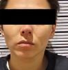 Mujer con cinta sobre los ojos detenida en Puebla.