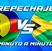 repechaje entre Nueva Caledonia y Jamaica con las banderas de ambos países en círculos y el texto 'Minuto a Minuto' sobre un fondo azul.