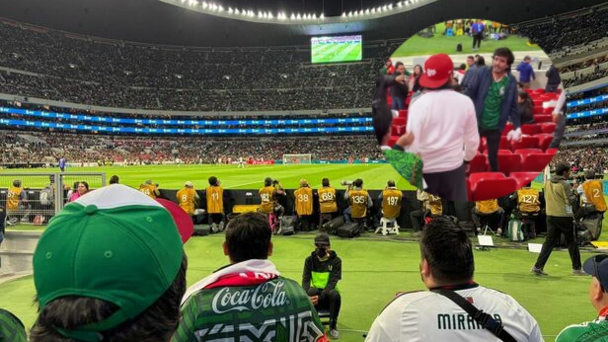 Aficionados en el Estadio Banorte peleando.