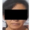 Ficha de vinculación a proceso de la Fiscalía de Jalisco con una foto de una mujer con los ojos censurados por un cuadro negro