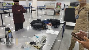 Hombre detenido en el AICM