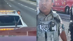 Elemento de la Guardia Nacional se azoma desde su vehículo y mira hacia un trailero.