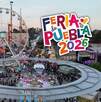 vista aérea de juegos mecánicos y personas en el recinto de la feria de puebla 2026