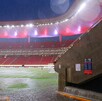 Cancha del Estadio Akron en Guadalajara durante un día de lluvia visto desde un pasillo