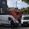 Policías investigan asesinato de familia en Azcapotzalco.
