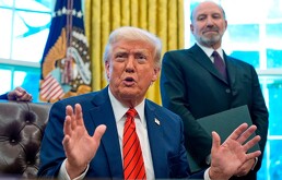 President Donald Trump speaks as he signs executive orders in the Oval Office of the White House