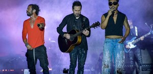 Integrantes de la agrupación Camila con sus instrumentos en la Feria de Puebla 2026
