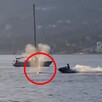 Hombre en moto acuática a punto de chocar contra una ballena gris en aguas de Canadá con una embarcación detrás