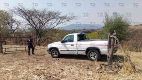 Imagen del momento en que fue encontrada una mujer muerta en los límites de Cohuecan-Huaquechula.