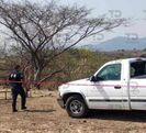 Imagen del momento en que fue encontrada una mujer muerta en los límites de Cohuecan-Huaquechula.