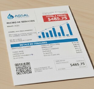 En una mesa se encuentra un recibo de Agsal con un total a pagar de 485.75.