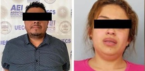 un hombre y una mujer detenidos con los ojos cubiertos