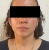 Mujer joven con el rostro cubierto tras ser detenida en Oaxaca.