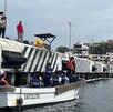Oficiales de la Secretaría de Marina a bordo de una lancha con el nombre Sayulita y resguardando el puerto de Manzanillo en Colima