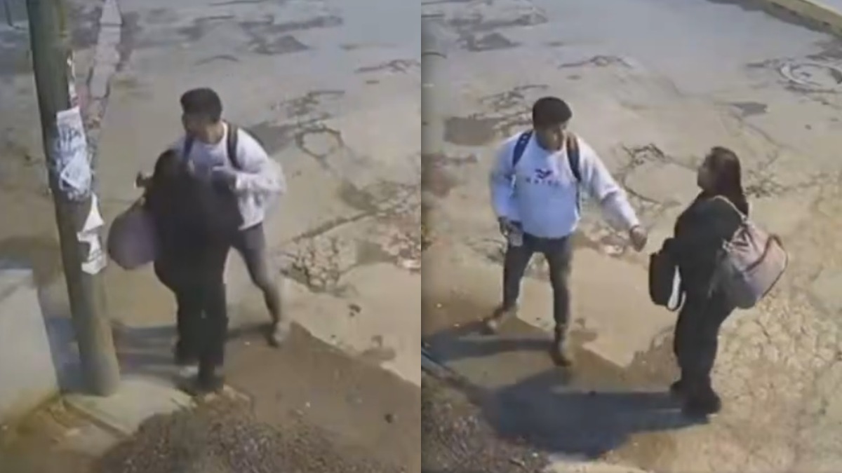 Mujer siendo asaltada por un hombre.