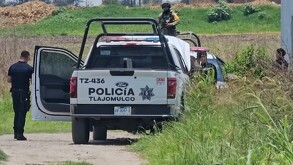 Policía municipal de Tlajomulco de Zúñiga en los hechos de la muerte de un hombre tras ser atacado a balazos.