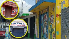 Cortinas de comercios cerradas en distintas calles